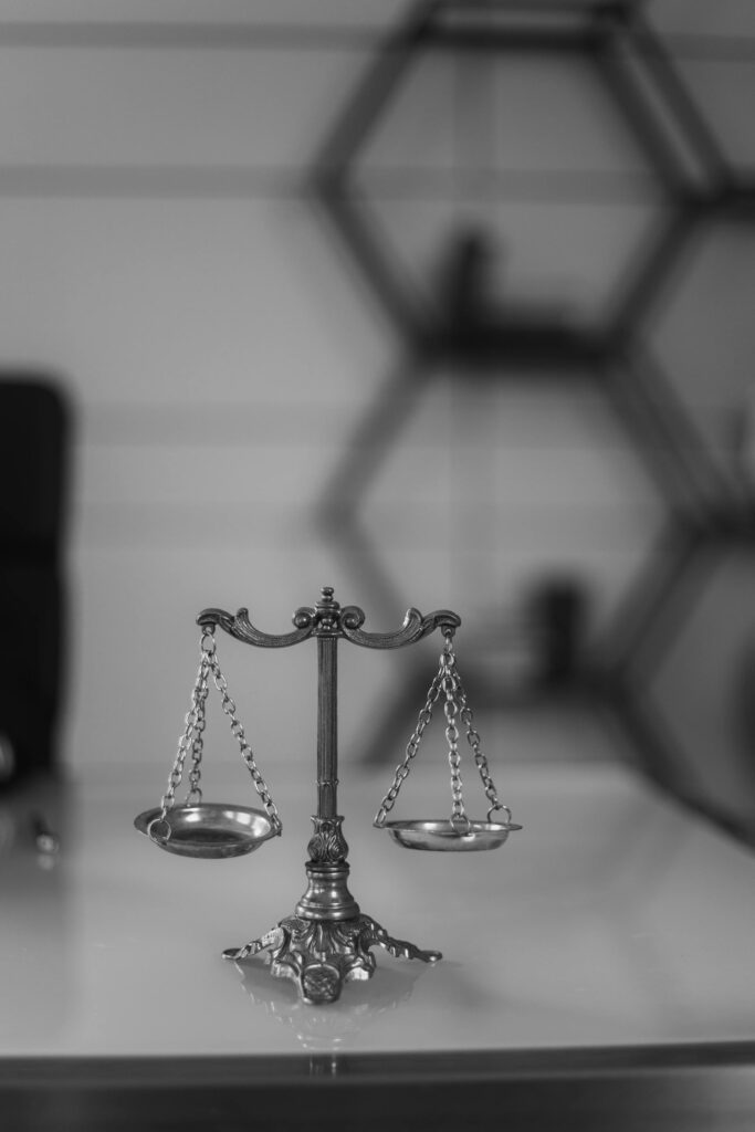 A black and white image of silver scales in a law office